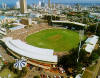 [Cricket ground -notice the oval nature and pitch in the center]